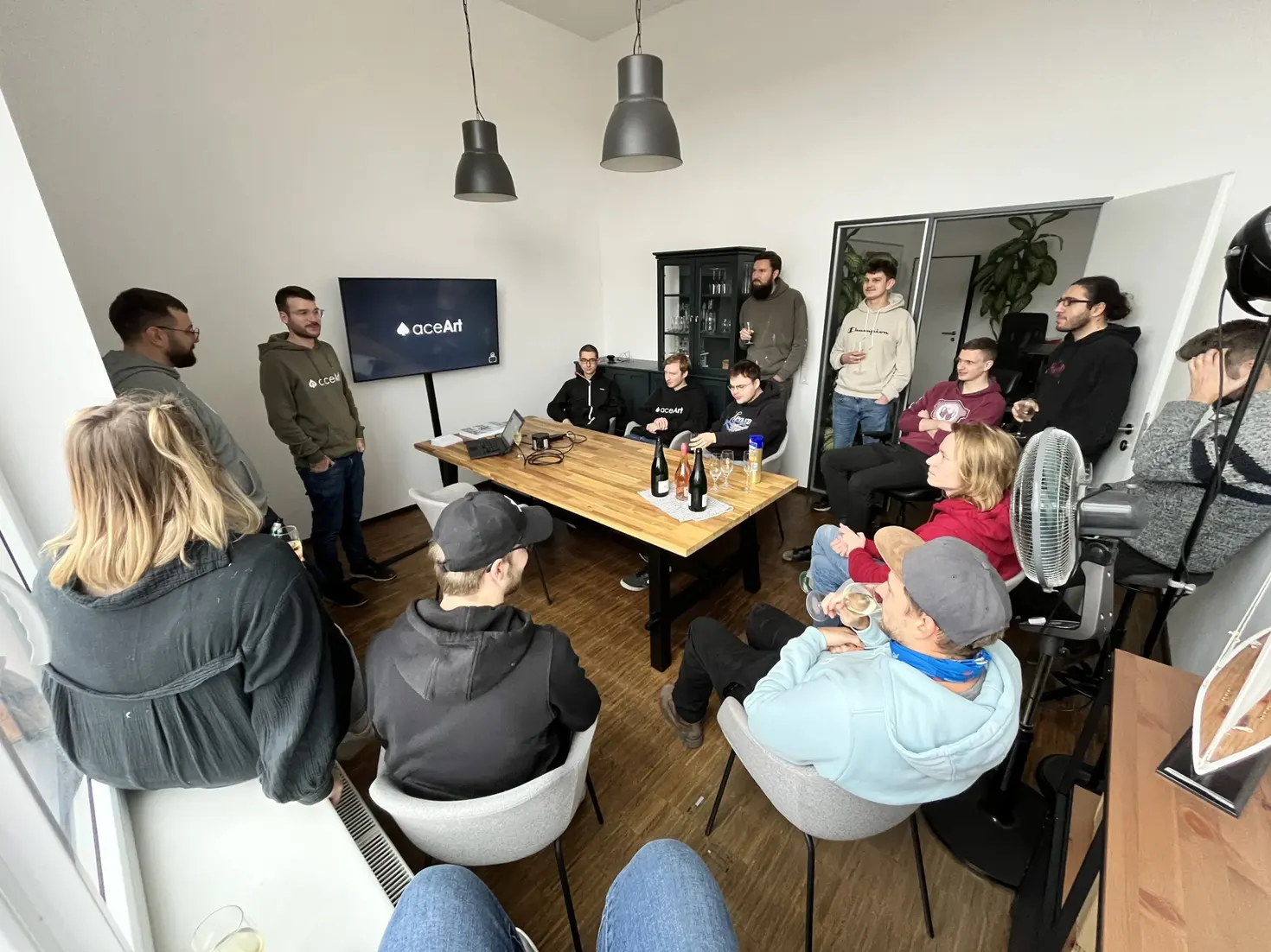 The aceArt team gathered in the meeting room